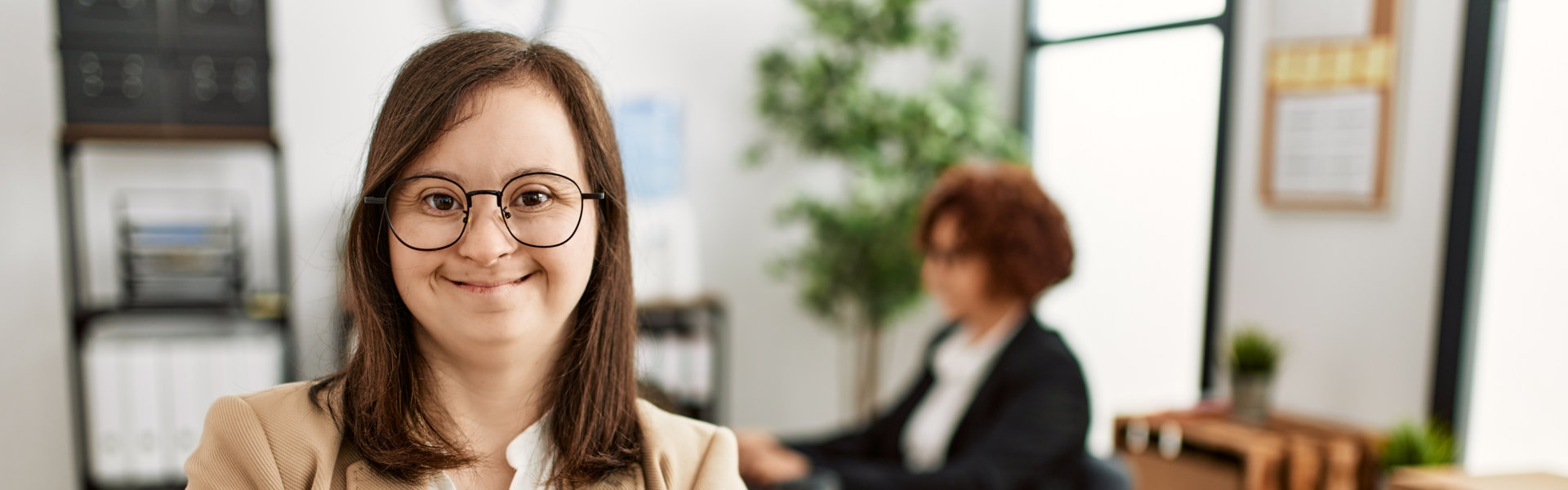 Down syndrome girl working at inclusive teamwork